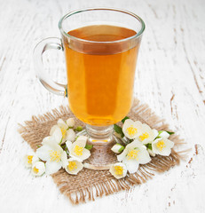 Cup of tea with jasmine flowers