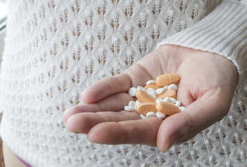 pills in female hands