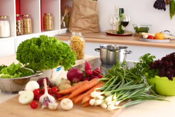 Pile of organic vegetables on a wooden table