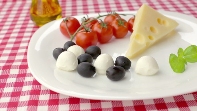 Italian classic ingredients for pasta with cheese, olives and vegetables