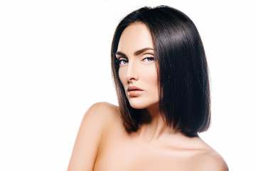 girl brunette model with perfect skin and hair in the studio on a white background