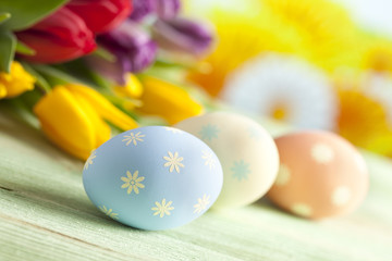 Colorful Easter eggs and spring flowers
