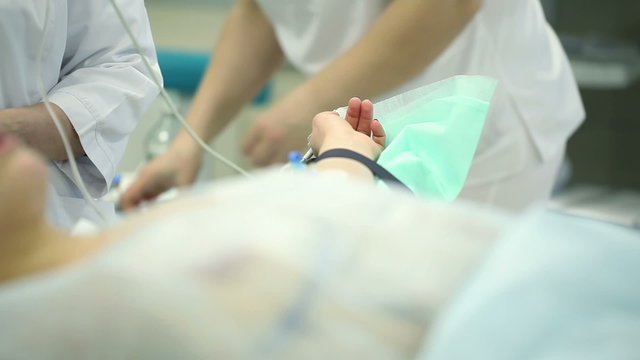 Female hand on the surgical table. Training in operating the operation mammaplasty