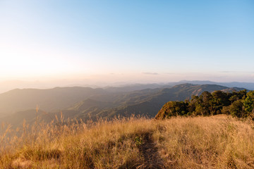 View of mountain range, mountain gap, mountain layer with bright sun shining on the sky at Doi Tu Lay (Mon Tu Lay) , Tak province Thailand