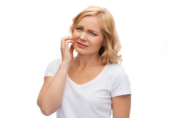 unhappy woman suffering from face inch
