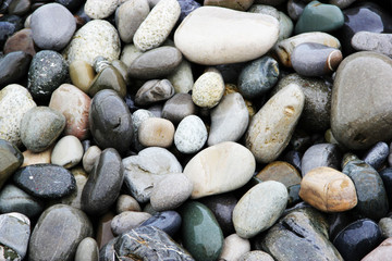 sea pebbles round stones natural background