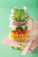 healthy vegetable salad in mason jar
