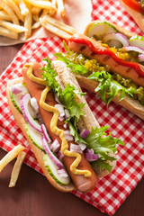 grilled hot dogs with vegetables ketchup mustard