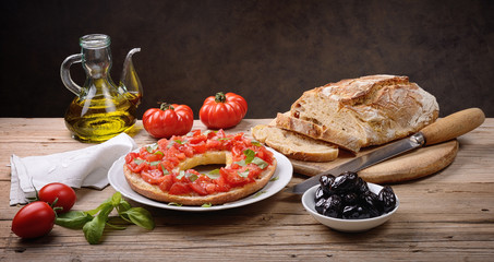 Frisella bread, with tomatoes, Castelvetrano olives, basil and extra virgin olive oil