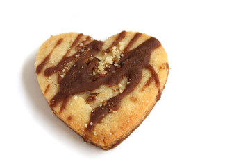 isolated heart shape cookie with chocolate and nuts with copy space