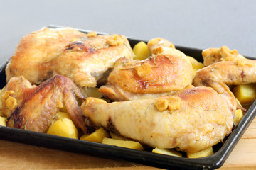 homemade baked jerk chicken with herbs and potatoes