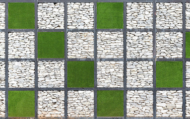 stone and artificial grass wall for background