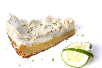 isolated piece of lemon meringue pie, tart, decorated with lime