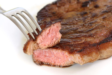 isolated served delicious piece of medium grilled beef steak on white background