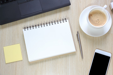 Top view of office desk table with computer, smartphone,stationery and coffee cup concept