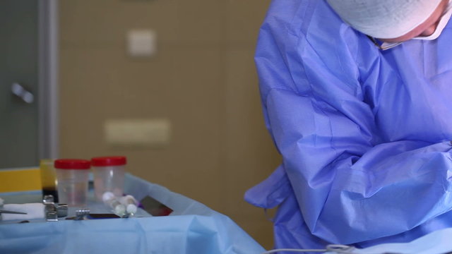 Breast augmentation surgery. The doctor cuts the chest with a scalpel. Dolly shot