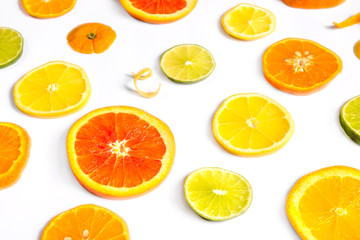Bright colorful design of various citrus fruit slices with oranges, lemons, limes, grapefruit and tangerines. 