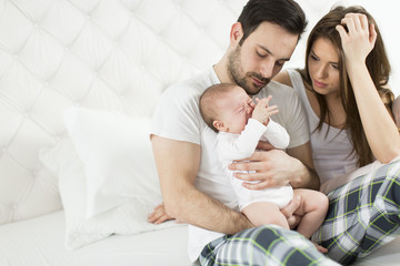 Fototapeta na wymiar Happy family with newborn baby