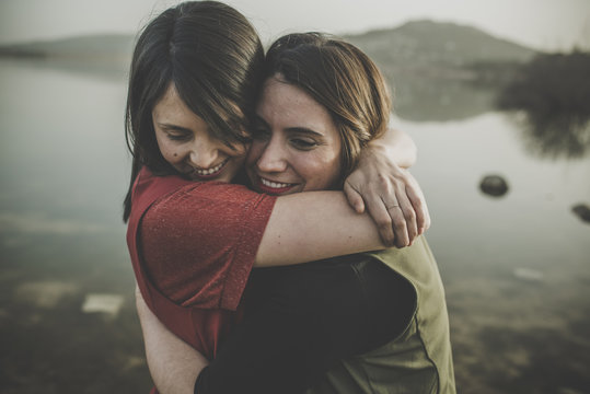 Fototapeta Lesbian couple showing affection women