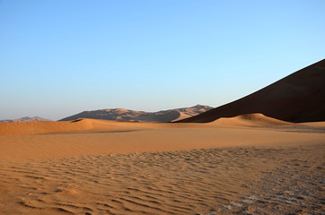 Empty plane and sand dunes in sahara desert