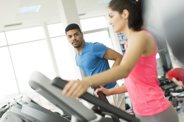 Fototapeta premium Young people training in the gym