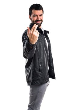 Man with leather jacket coming gesture
