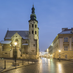 Fototapeta na wymiar old church with street lights in Krakow in Poland