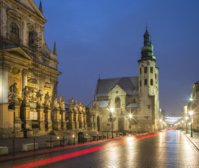 Fototapeta premium red cars trails on the street in Krakow in Poland