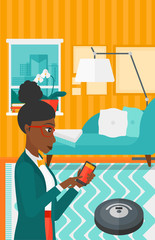 Woman with robot vacuum cleaner.