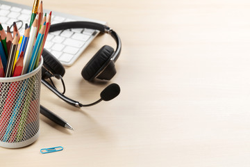 Office desk with headset and pc