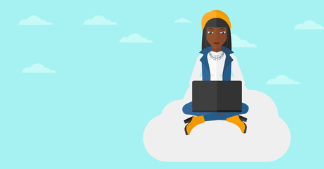 Woman working on laptop.