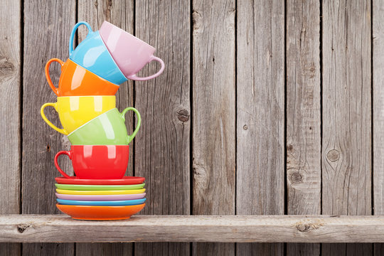 Colorful Coffee Cups On Shelf