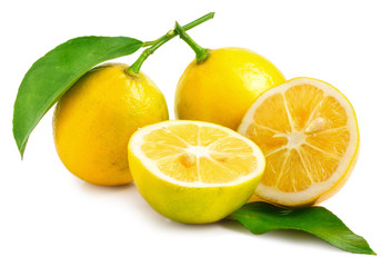 Two Lemons - one sliced in half on white background