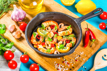 prawn tails, fried in olive oil with spices, top view