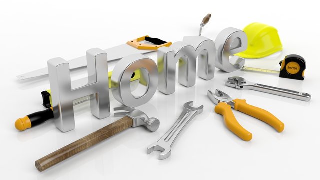 Various hand tools with 3D word Home, isolated on white background.