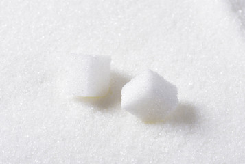 Two white sugar cubes