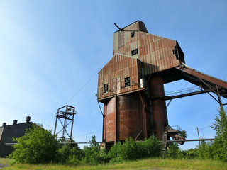 Abandoned industrial mill with rusty steel walls - landscape color photo