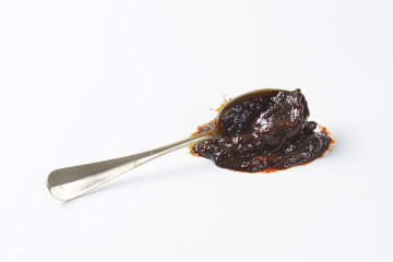 Spoon of plum jam