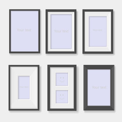 Set of black photo frames on the wall 