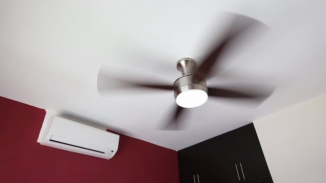 Electric ceiling fan and wall split-system air conditioner  indoors

