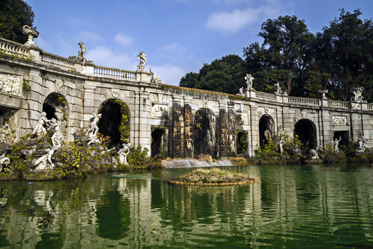 Caserta Royal Palace and his gardens - fountain with statues and water reflections
