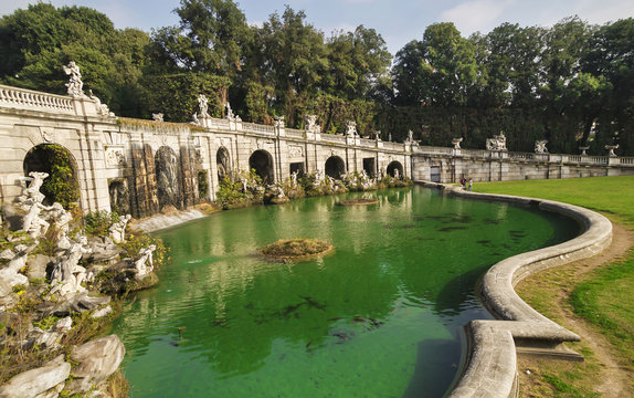 Caserta Royal Palace and his gardens - fountain with statues and water reflections
