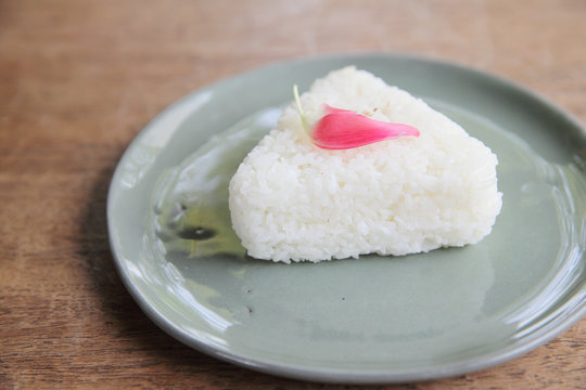 Thai rice on wood background