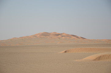 Fototapeta na wymiar Sand dune on empty plane desert Dubai