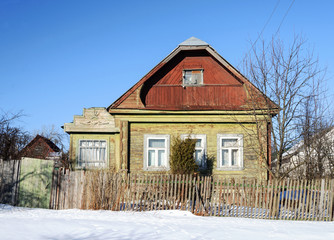 Old abandoned wooden house in winter
