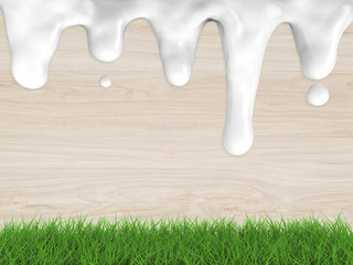 flowing cream milk on wooden background