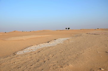 White broken sand floor and dunes in Oman