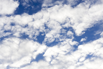 cirrus clouds against the blue sky background
