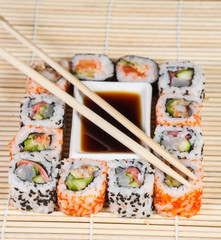 Different types of Sushi in a plate isolated on white background