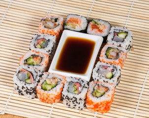 Different types of Sushi in a plate isolated on white background